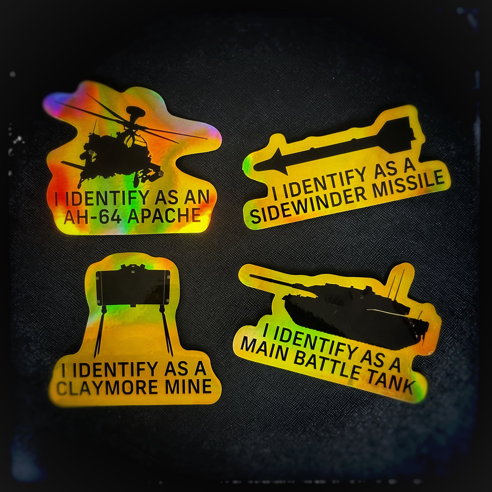 Black Trident Inklusive Sticker –Aufkleber und Sticker Set mit,  I identify as an Apache helicopter Sticker, I identify as a sidewinder missile Sticker, I identify as claymore mine Sticker und I identify as a main battle tank Sticker. Black Trident ist ein österreichisches Unternehmen, das sich auf das Design, die Entwicklung und die Produktion von taktischer Ausrüstung spezialisiert hat. Werde Teil der Community und des Black Syndicate, indem du dir noch heute dein Sticker holst! Patchworld patchworld.net