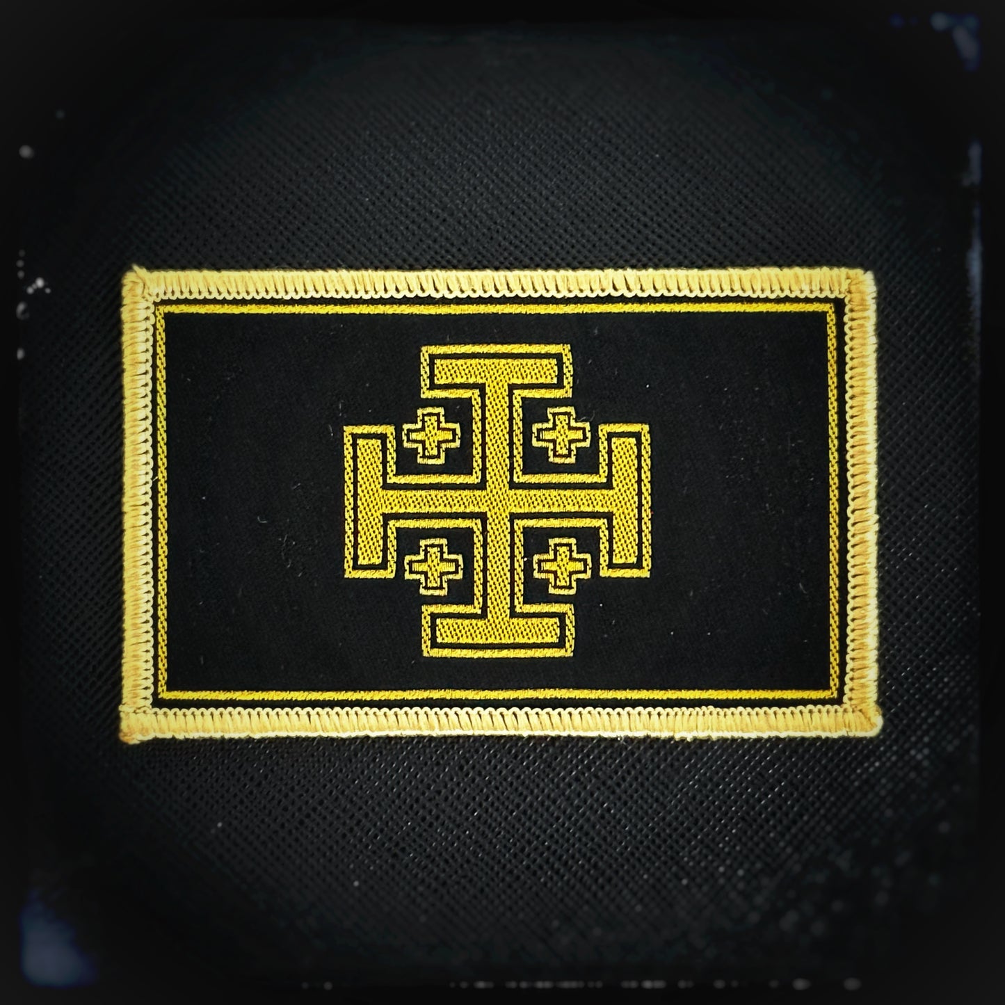 Woven patch with velcro: Jerusalem Cross, est. 11th century. Proudly display your devotion, honour the legacy of those who carried the cross before us and stand firm in your faith. The Jerusalem or Crusader's Cross symbolizes the spread of Christianity to the four corners of the world, with the large central cross representing Jerusalem and the four smaller crosses signifying the Gospels. This high-quality Christian patch. Patchworld. patchworld.net