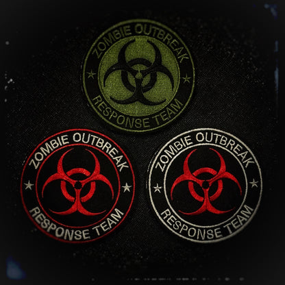 Embroidered patch with velcro: Zombie Outbreak Response Team. Preparing for a zombie apocalypse is the key for survival. The Zombie Outbreak Response Team (ZORT) is able to handle a zombie apocalypse. Tasked with containing zombies, rescuing survivors, and ensuring safety, ZORTs is about surviving and fighting back against the zombie threat. Ensure meet likeminded individuals by wearing these colorful patch. High quality and durable PVC, woven and embroidered patches for collectors, airsofters and military